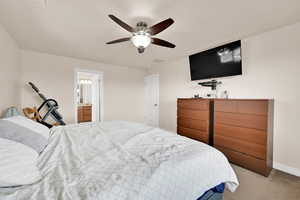 Bedroom featuring carpet floors and ceiling fan