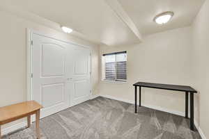 Unfurnished office featuring light colored carpet and baseboards