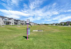 Surrounding community featuring a residential view and a yard