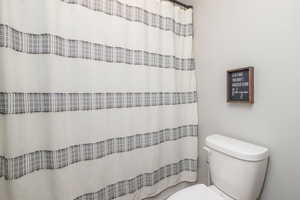 Full bathroom with a shower with shower curtain