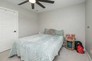 Bedroom with carpet and ceiling fan