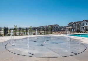 Community pool with a residential view and a patio