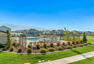 Community pool featuring a residential view