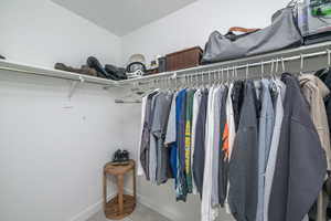 Spacious closet featuring carpet flooring
