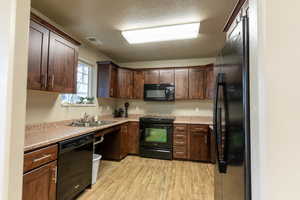 Clubhouse kitchen with black appliances, is a perfect party place with large kitchen reserved for parties of the residents !