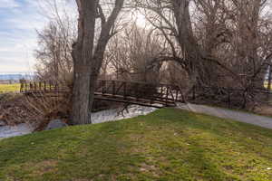 A pedestrian bridge crosses Logan River , allowing River Crossing residents easy access to the river's' edge pathway .