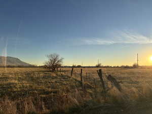 Fenced by the road, but open in the middle for more land to graze.