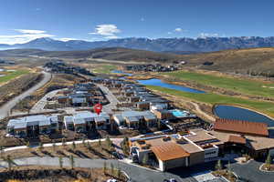 Bird's eye view of a water and mountain view and a golf course