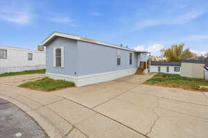 View of front facade featuring concrete driveway