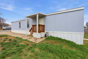 View of front of property with a front yard