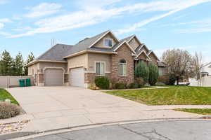 Craftsman-style house featuring stucco siding, stone siding, driveway, a garage, and roof with shingles