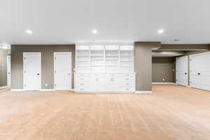 Basement featuring light carpet and recessed lighting