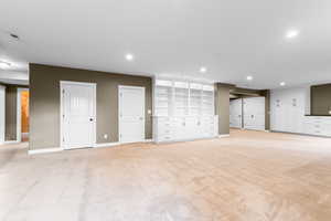 Basement featuring light carpet and recessed lighting