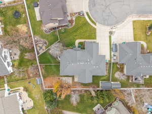 Aerial view of property and surrounding area with nearby suburban area