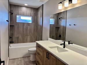 Full bathroom featuring vanity and shower / tub combination