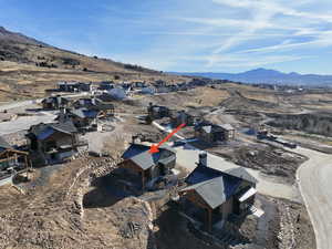 Aerial perspective of suburban area featuring a mountainous background