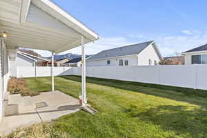 Fenced backyard with a patio and a mountain view