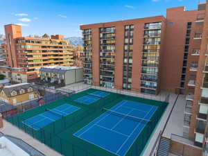 View of tennis court with a mountain view