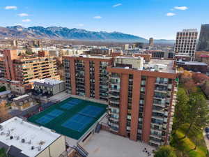 View of urban area featuring a mountain backdrop and apartment complex