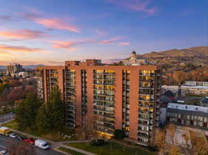 Property at dusk with a view of apartment building / complex
