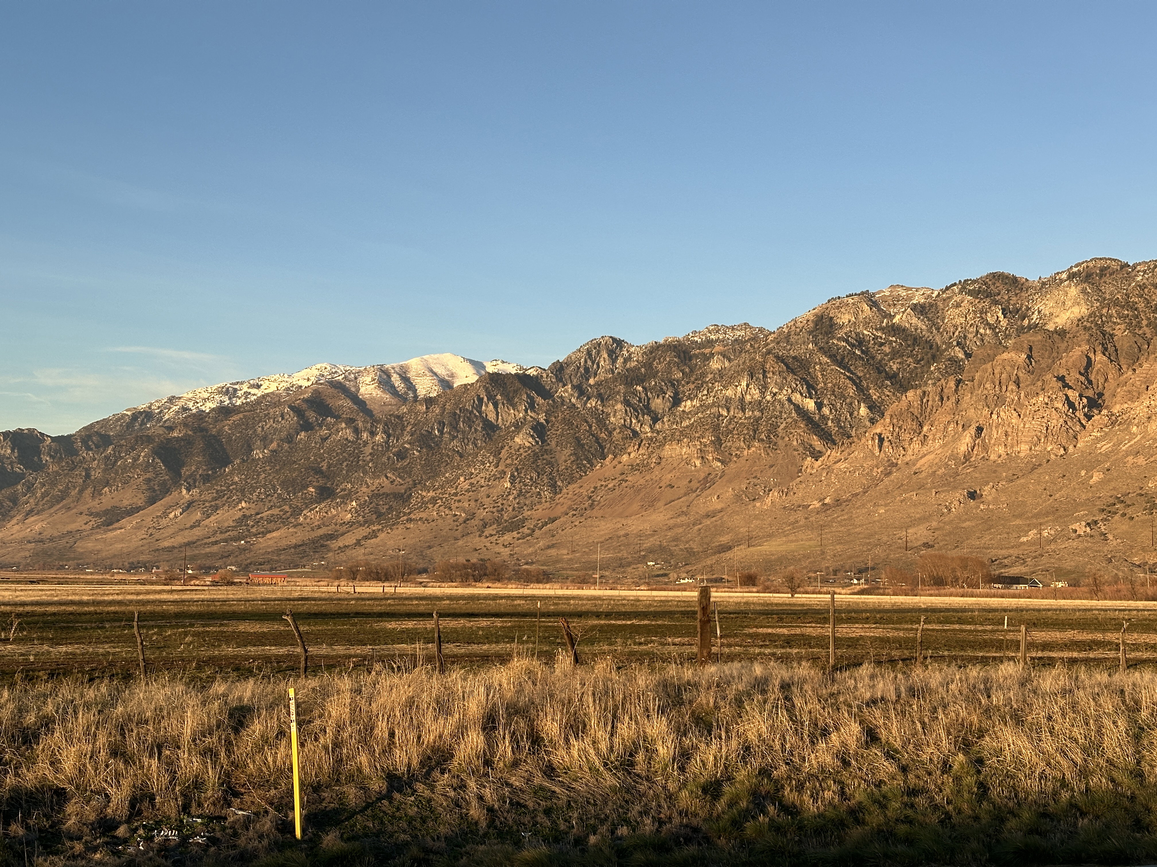 View looking northeast from Highway 13, yellow stake is gas marker