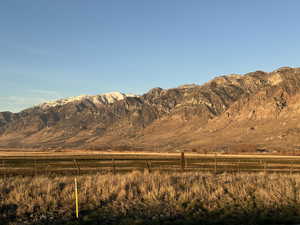 View looking northeast from Highway 13, yellow stake is gas marker