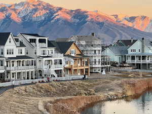 Back of house at dusk with a mountain view