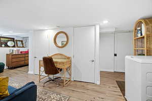 Office featuring washer / clothes dryer, light wood finished floors, and recessed lighting