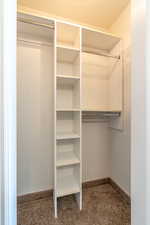 Walk in closet featuring carpet flooring