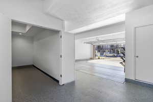 Garage featuring baseboards