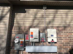 Exterior view of pet washing area, brick siding, and related energy utilities