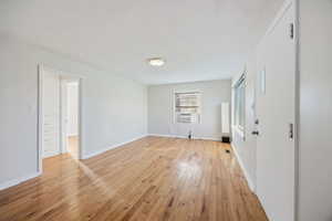 Spare room with light wood finished floors and baseboards