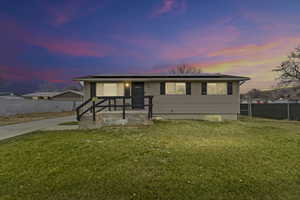 View of front of home with roof mounted solar panels