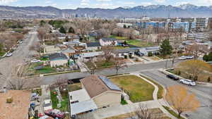Aerial perspective of suburban area featuring a mountain backdrop