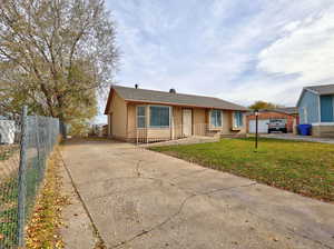 View of front of house with concrete driveway and roof with shingles