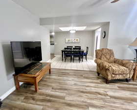 Living area  into dining area with New LPV wood style floors.