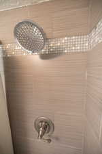 Bathroom view of a tile shower
