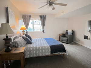 Bedroom featuring New carpet and ceiling fan
