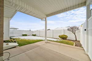 Fenced backyard featuring a patio area
