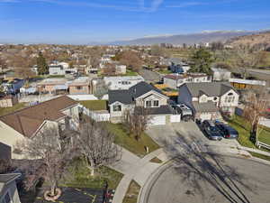 Aerial perspective of suburban area with a mountainous background