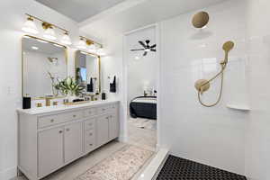 Master Full bath featuring ensuite bathroom, walk in shower, double vanity, and a ceiling fan