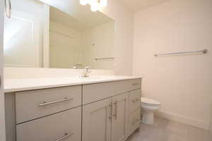Bathroom featuring vanity and light tile patterned floors