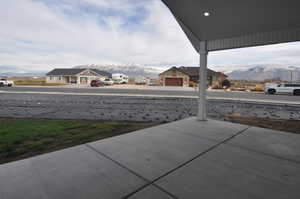 View of patio / terrace with a mountain view