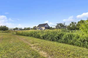 View of yard featuring a view of rural / pastoral area