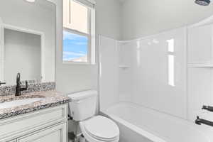 Full bath featuring vanity and shower / washtub combination