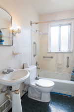 Full bathroom featuring linoleum floors and toilet