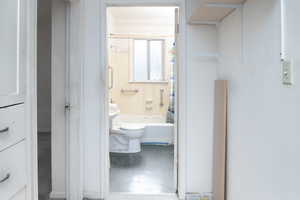 Full bathroom featuring linoleum floors and toilet