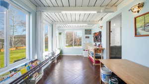 Sunroom/craft room with beam ceiling