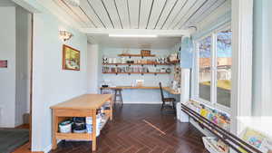 Sunroom/craft room with beam ceiling