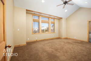 Empty room with carpet flooring, a ceiling fan, recessed lighting, and high vaulted ceiling